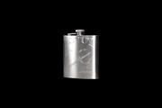 An engraved hip flask