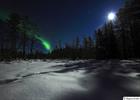 Northern Lights and full moon in Lapland